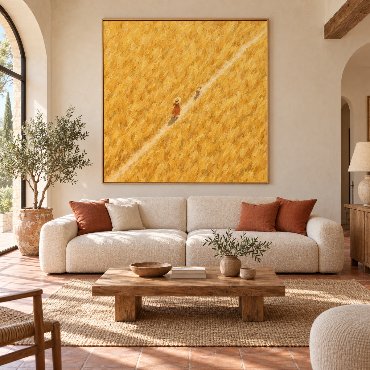 Oversized 72x72 inch aerial oil painting of a woman in a straw hat walking a dog through a golden wheat field above a sofa in a sunlit Mediterranean villa living room