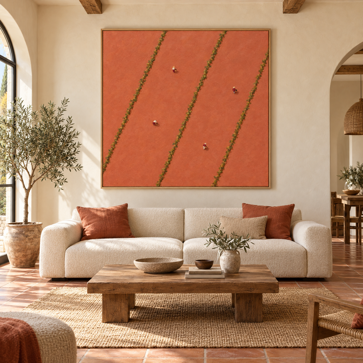 Oversized 72x72 inch aerial vineyard oil painting with tiny grape pickers between vine rows above a sofa in a sunlit Mediterranean villa living room