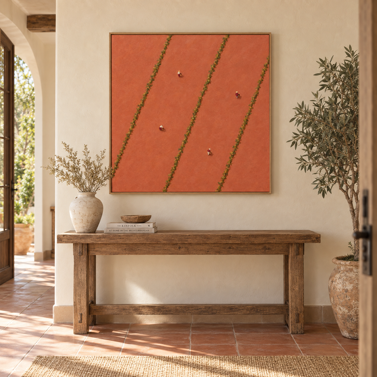 40x40 inch aerial vineyard oil painting with tiny grape pickers between vine rows above a console table in a sunlit Mediterranean villa entryway